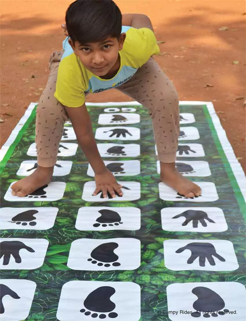 Kid playing Hand Feet Hopscotch Game
